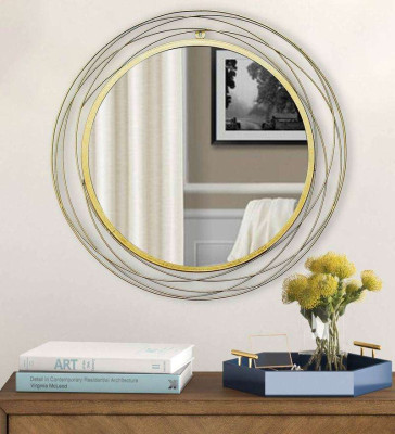 Round wall mirror in golden colour 1