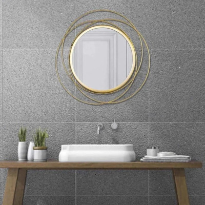 Round wall mirror in golden colour